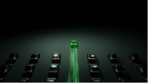 A green car in a row of cars